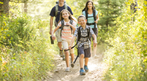 Caucasian family hiking on path